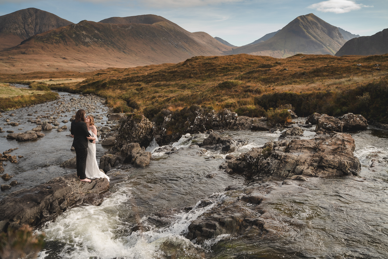 Bride and grrom elope to Skye and stand in waterfall