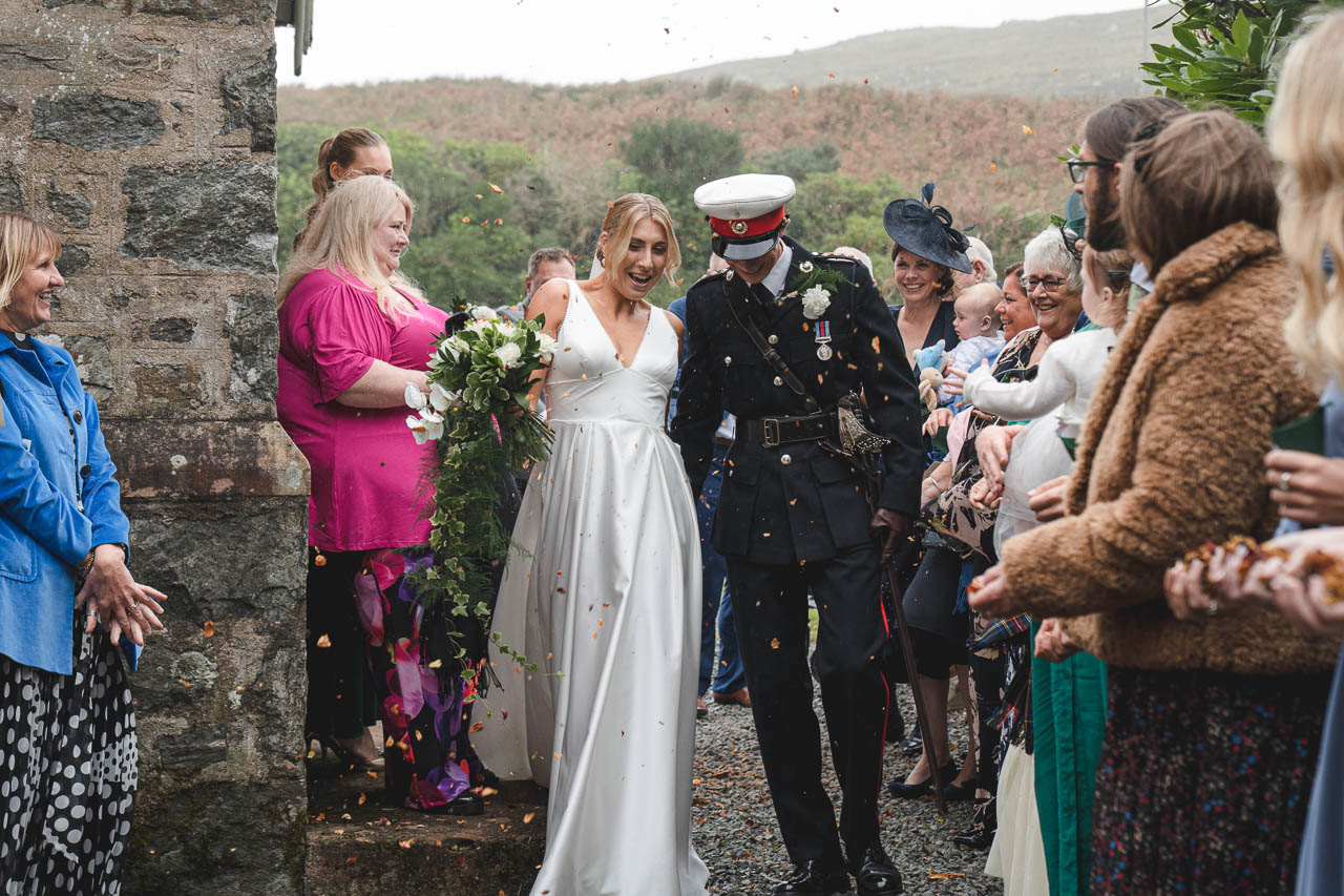 couple getting married with their friends and family around them at hteir isle of skye wedding