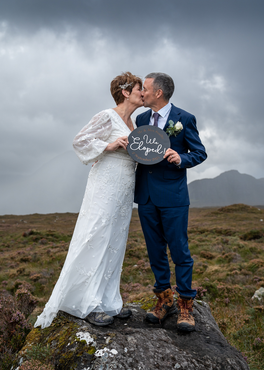 Couple overlooking the Cuillin mountains during an intimate Skye elopement.